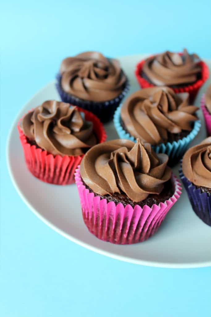 vegan chocolate cupcakes with buttercream icing on a plate